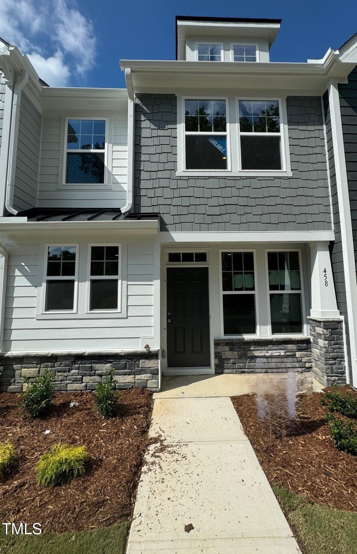 a house with yard in front of it