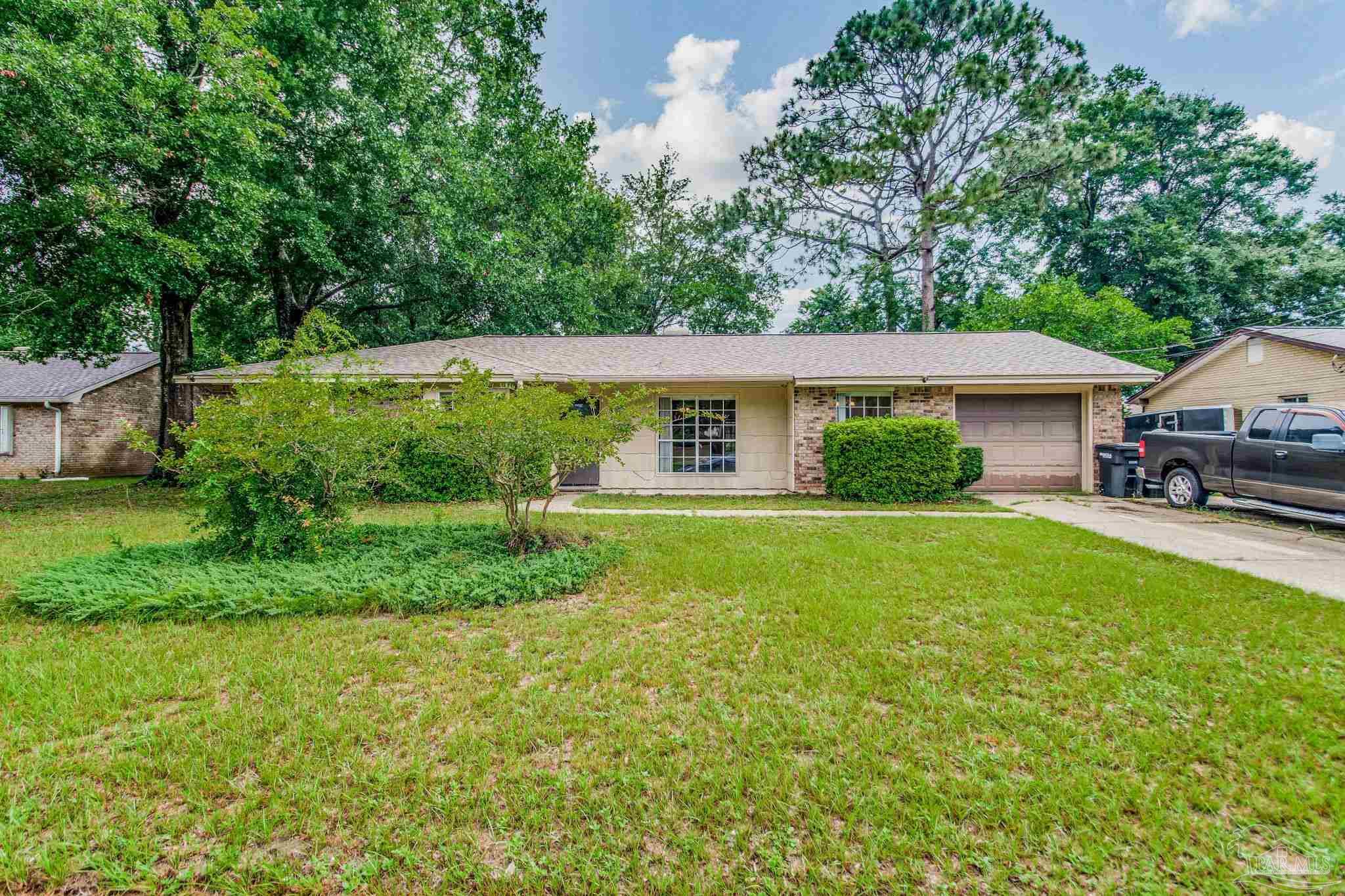 a house that is sitting in the grass