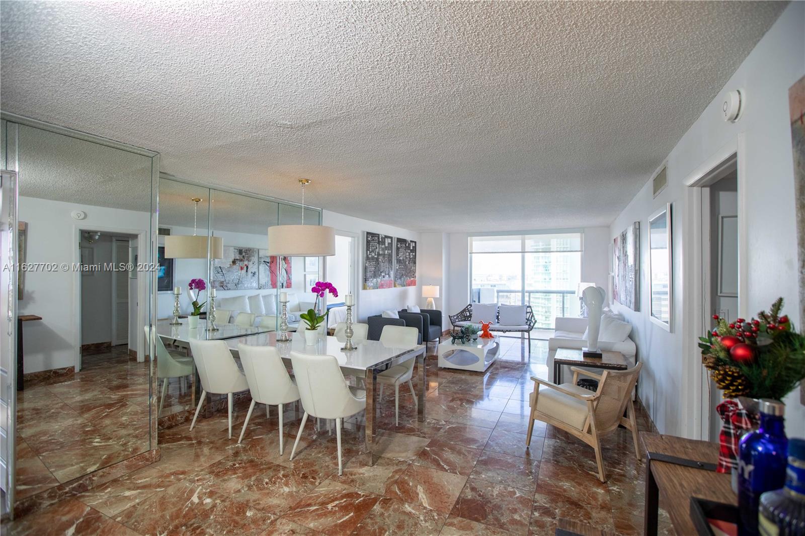 a view of a dining room with furniture window and outside view