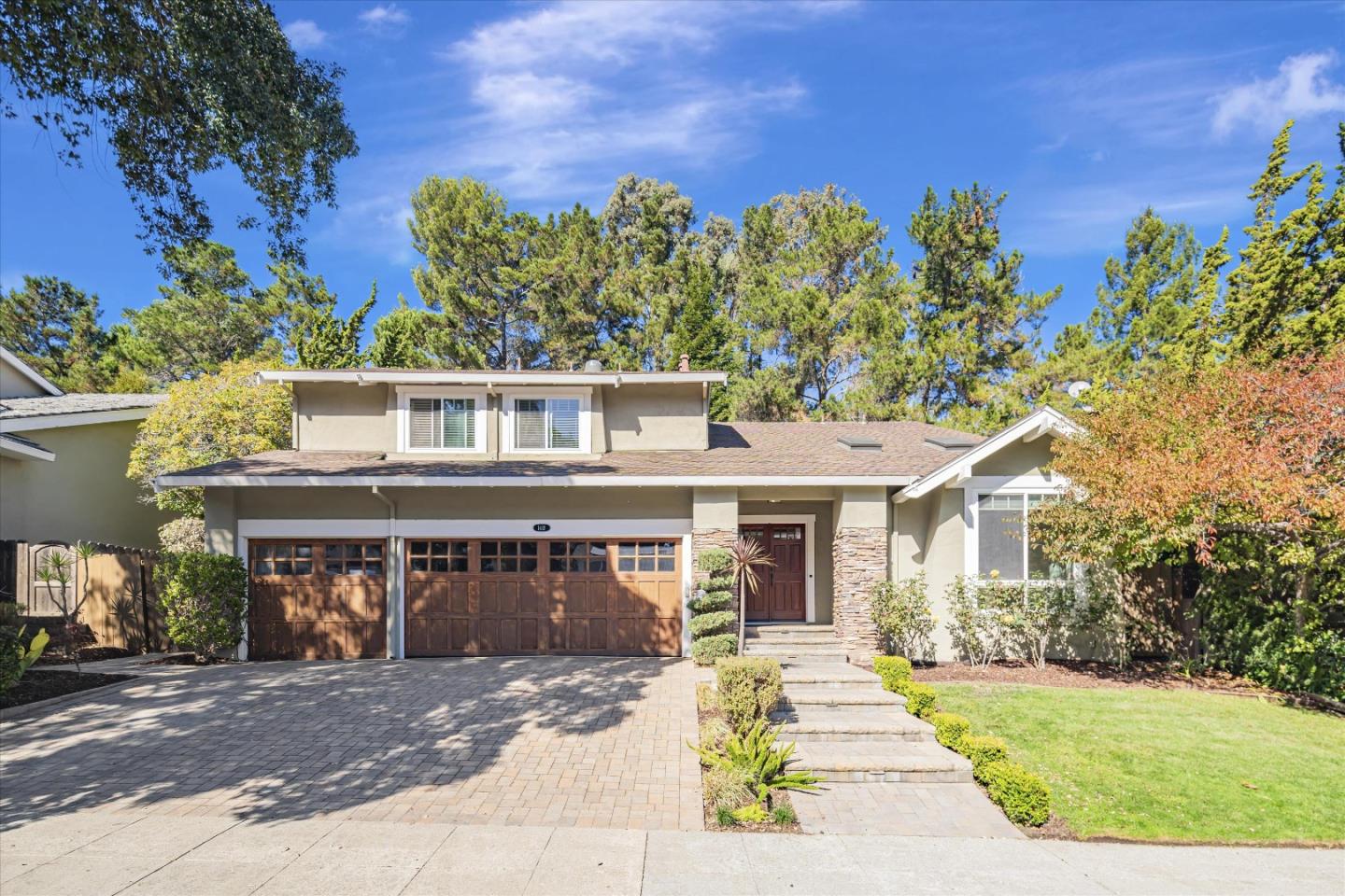 front view of a house with a yard