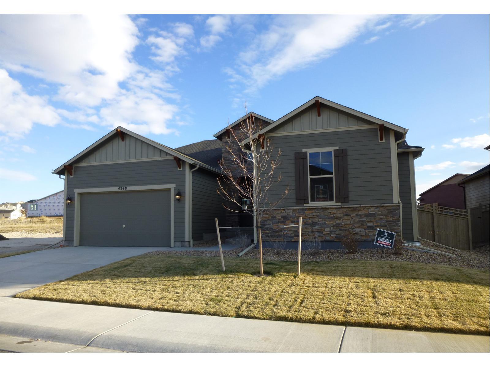 a front view of a house with garage