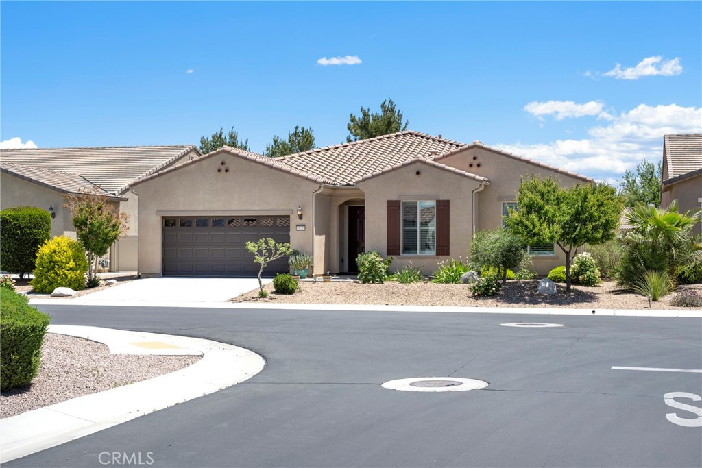 a front view of a house with yard