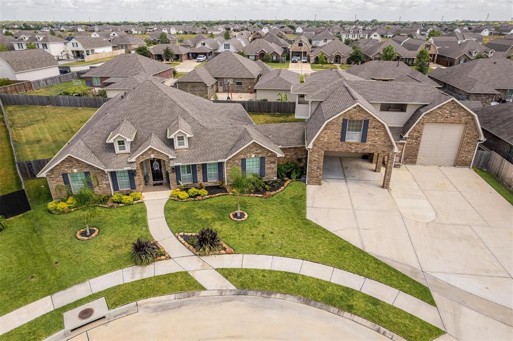 an aerial view of a house with swimming pool