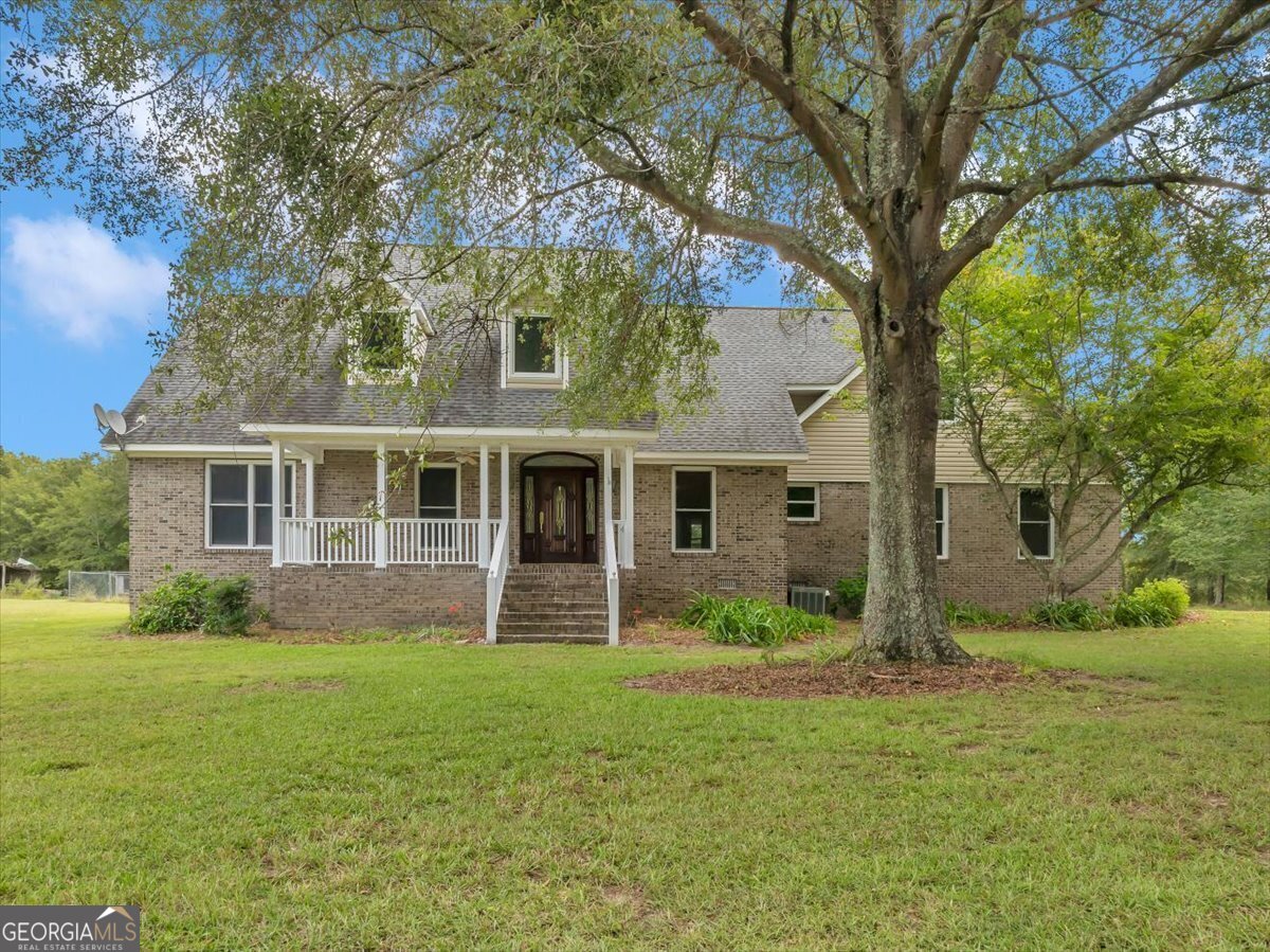 front view of a house with a yard