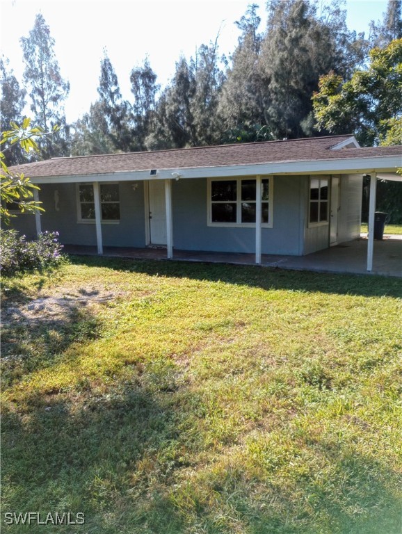 a view of a house with a yard