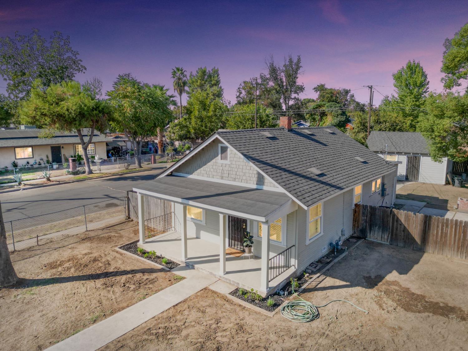 a aerial view of a house with a yard