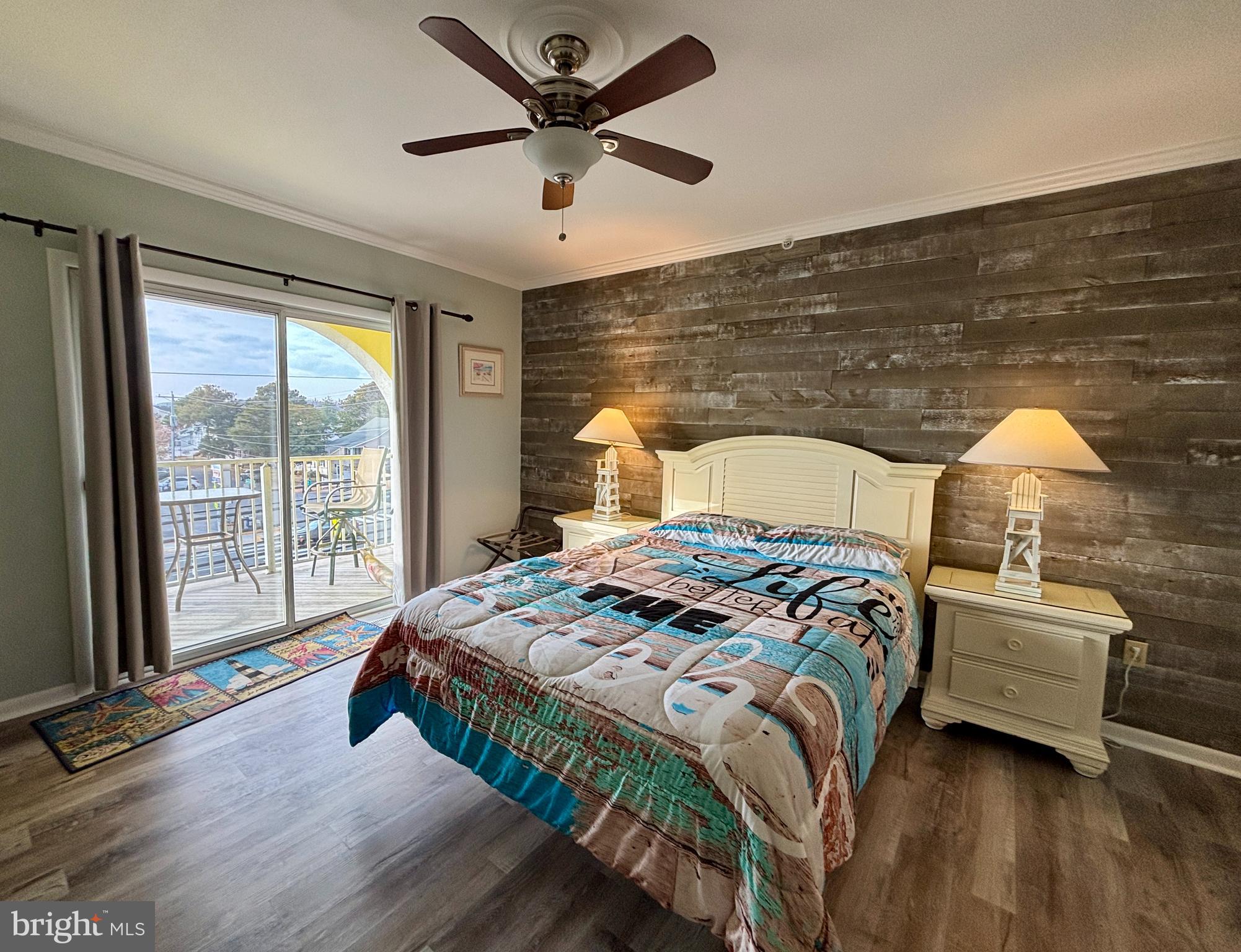 a bedroom with a bed next to a large window with the outer view