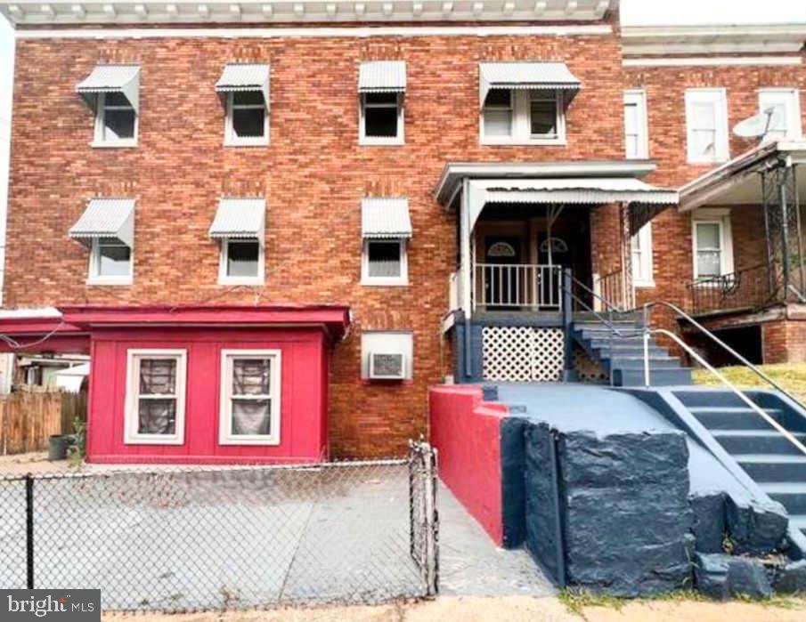 a front view of a house with parking