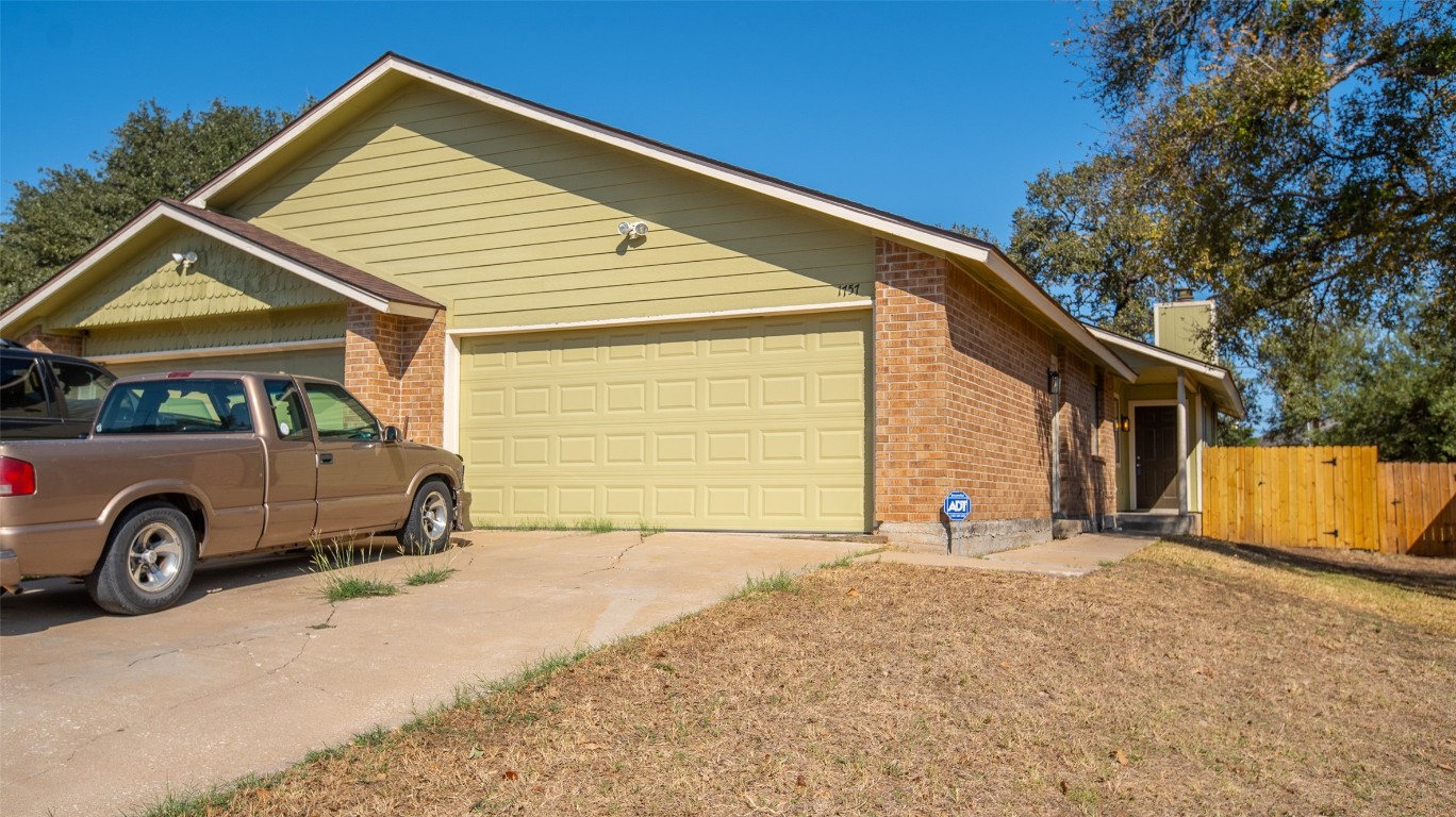 a view of a car in front of a house