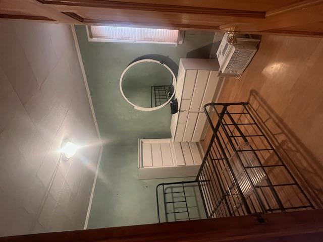 Bedroom featuring wood-type flooring and ornamental molding