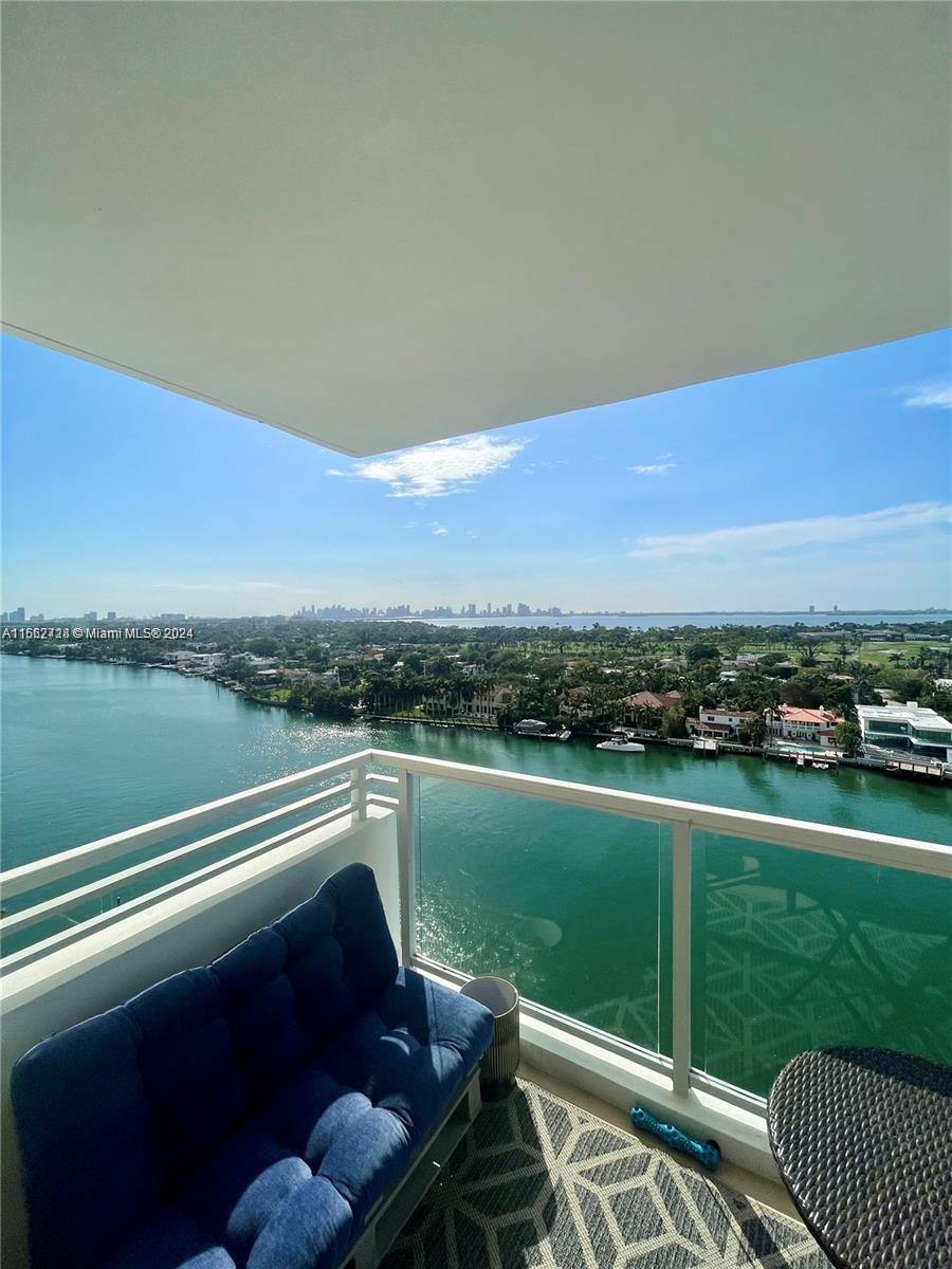 a view of a city from a balcony with outdoor space