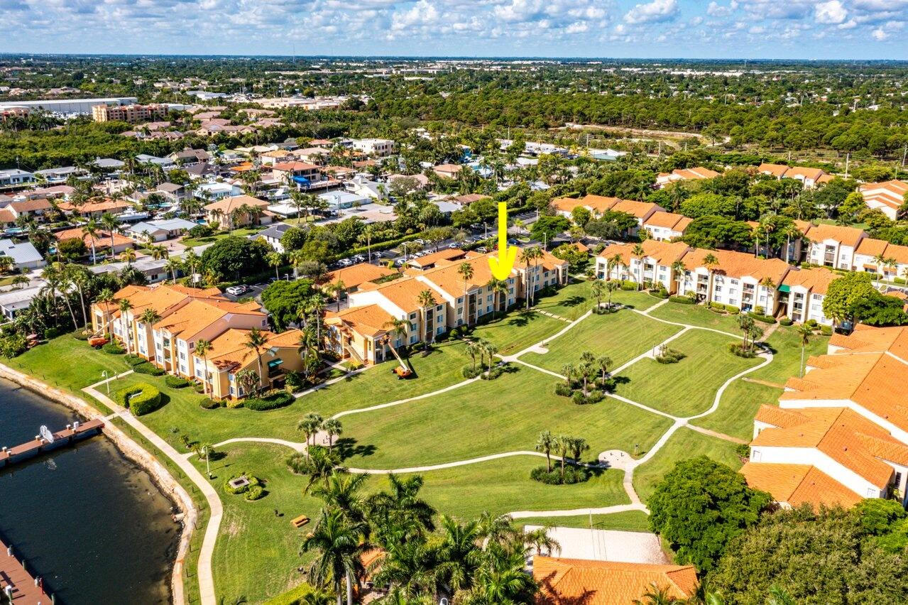 an aerial view of a pool yard residential house and outdoor space