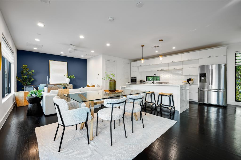 a view of a dining area with furniture and wooden floor