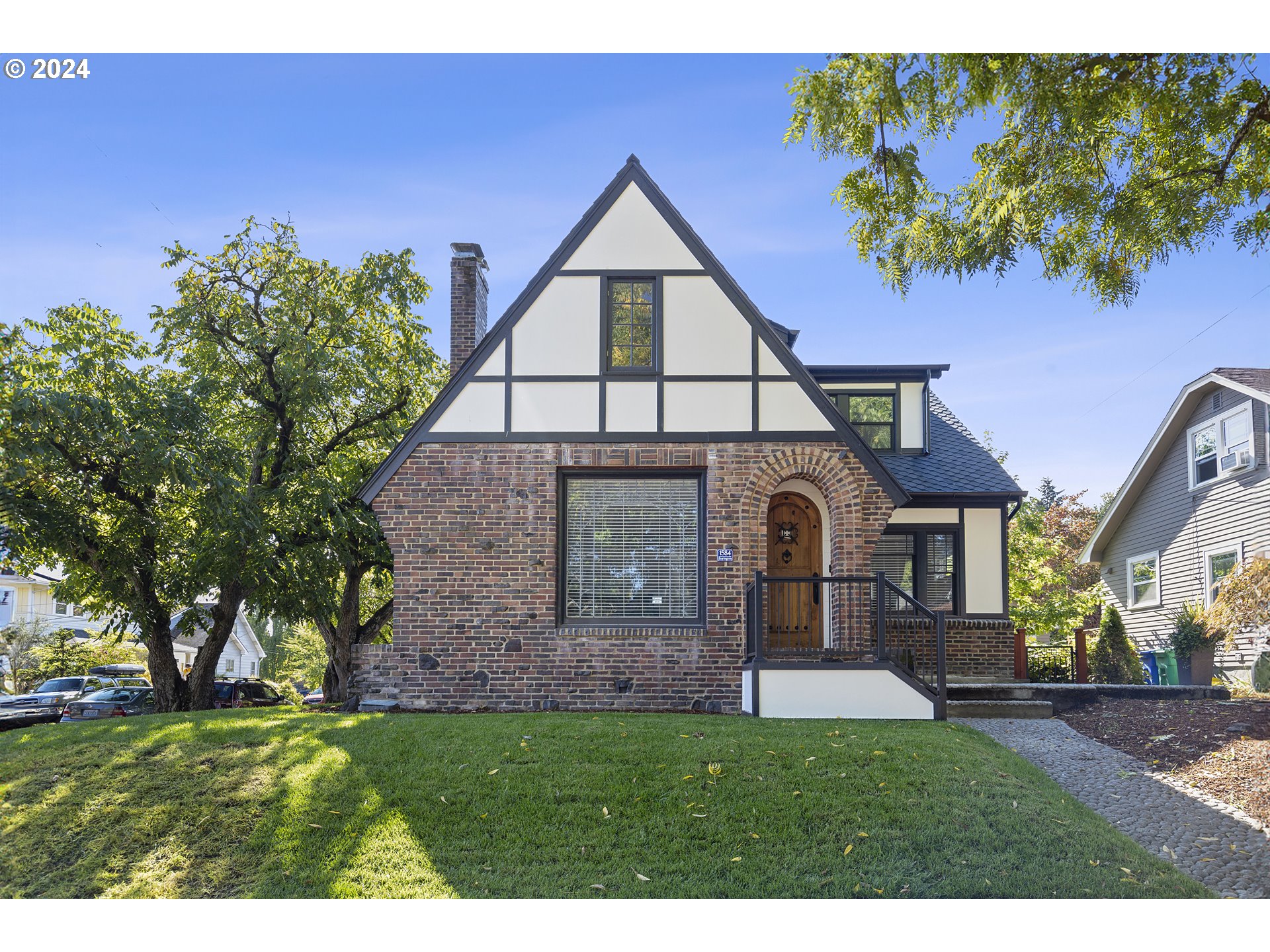 a front view of a house with garden