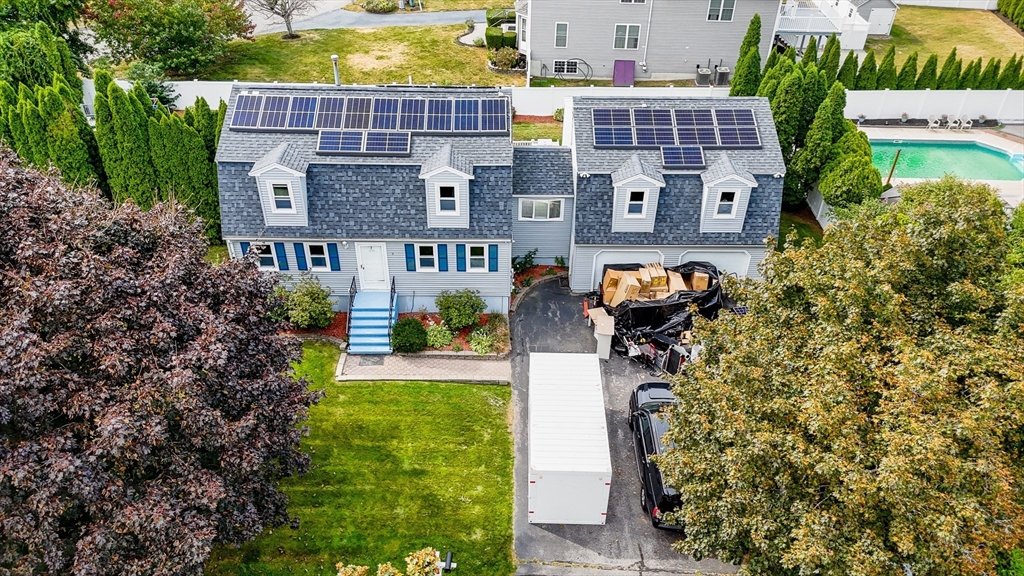 an aerial view of a house with outdoor space