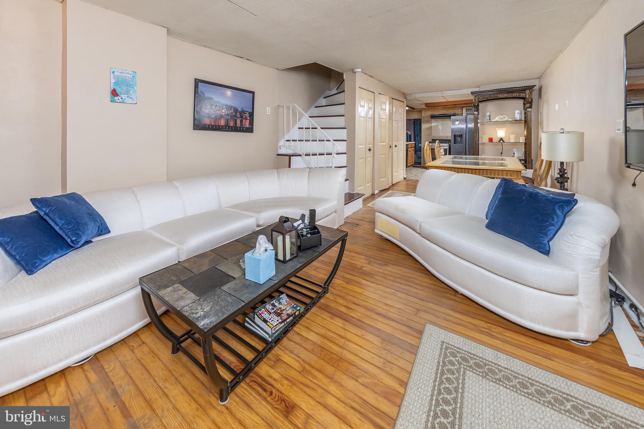 a living room with furniture and a rug