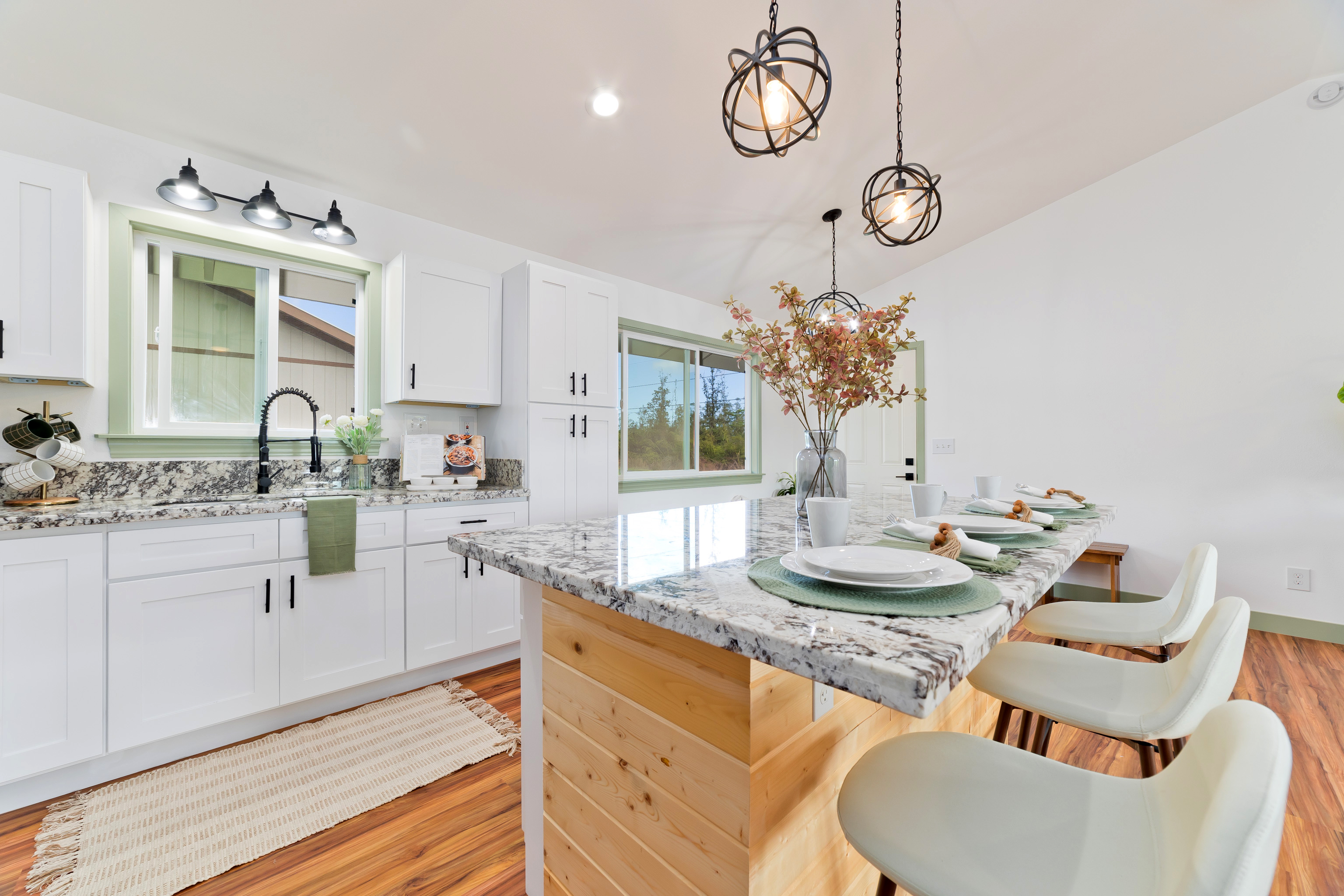 a kitchen with a sink stove and microwave