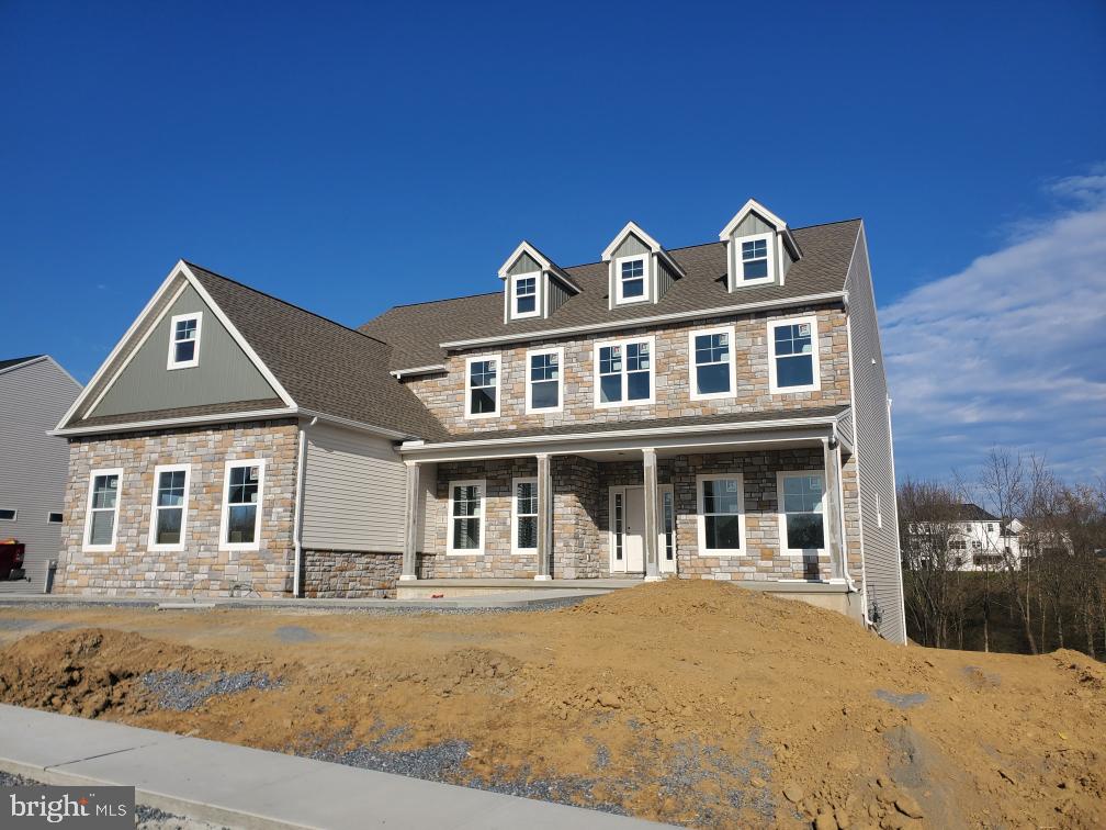 a front view of a house with yard