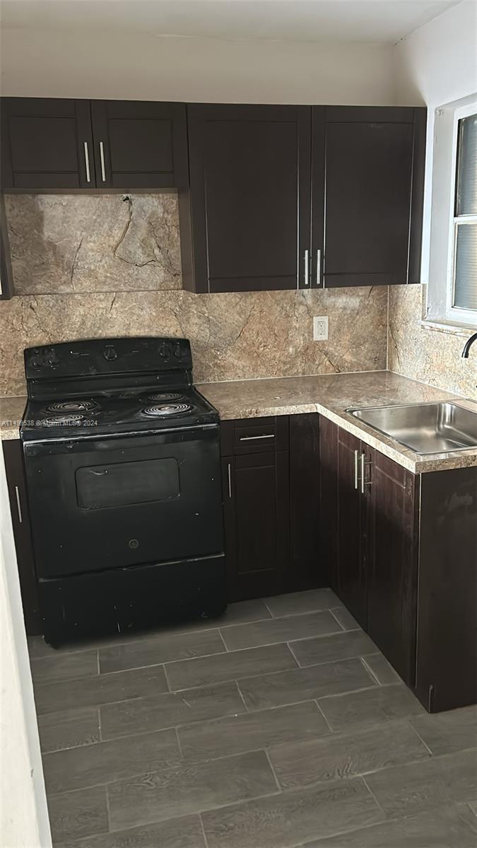 a kitchen with a stove and a sink