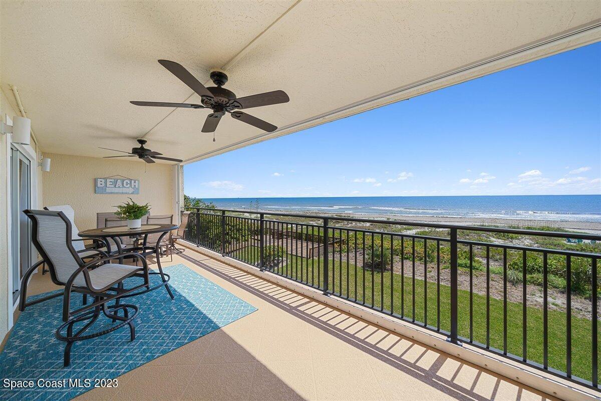 a view of a balcony with furniture