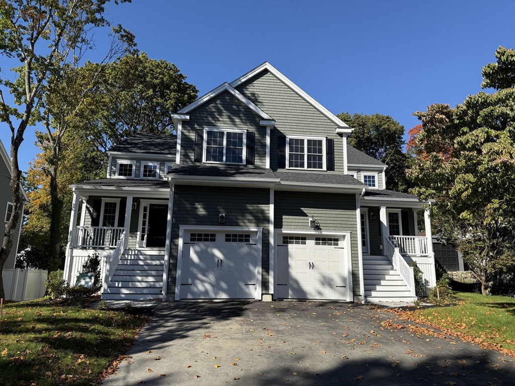 a front view of a house with a garage