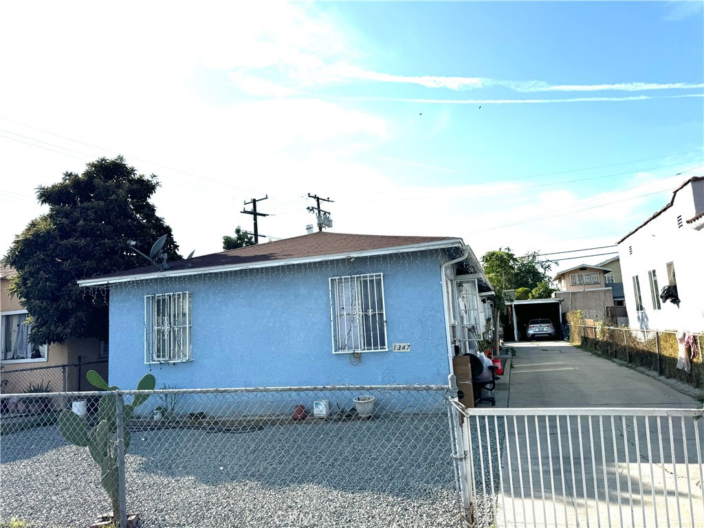 a front view of a house with parking space