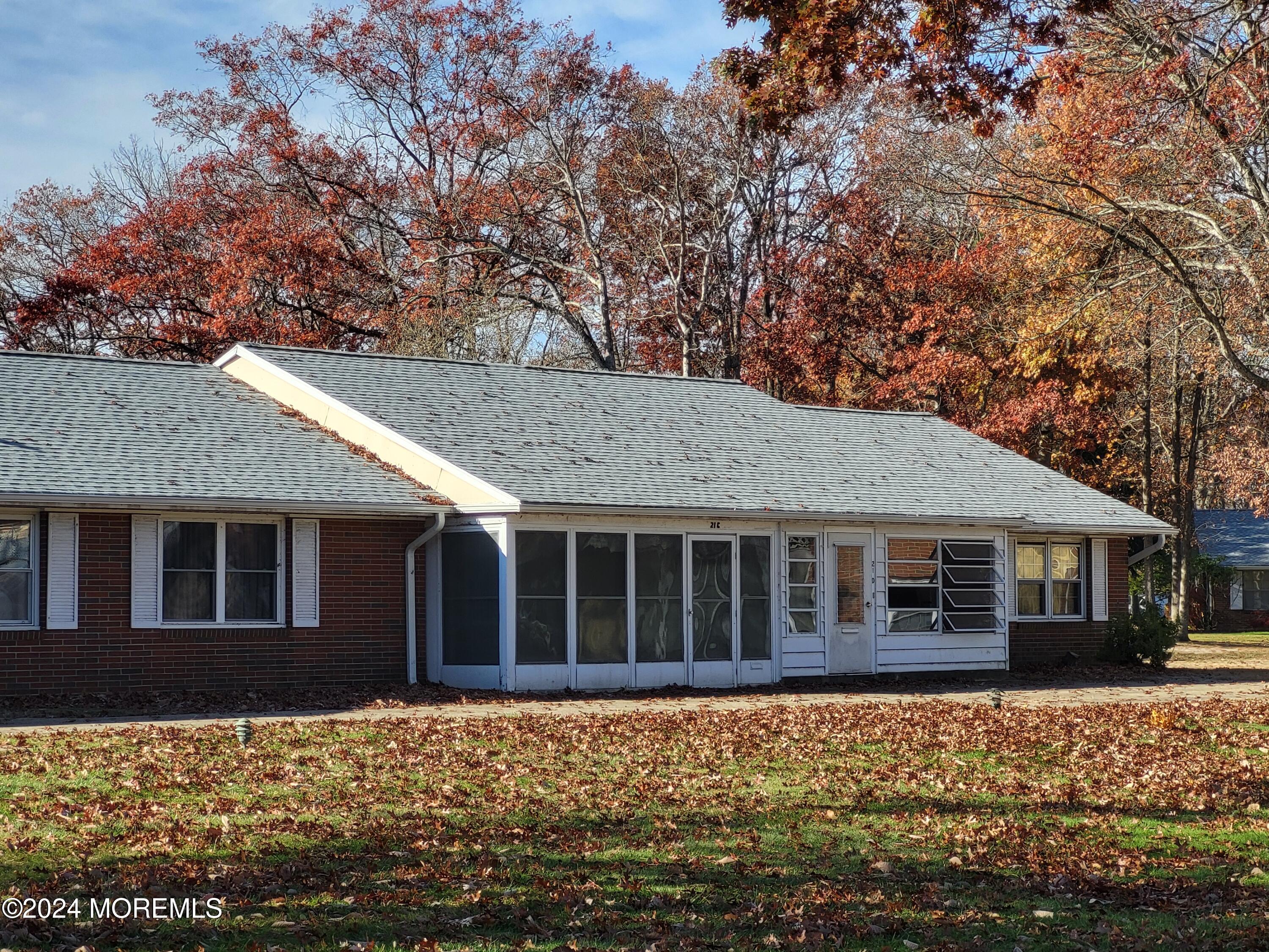 a house with trees in the background