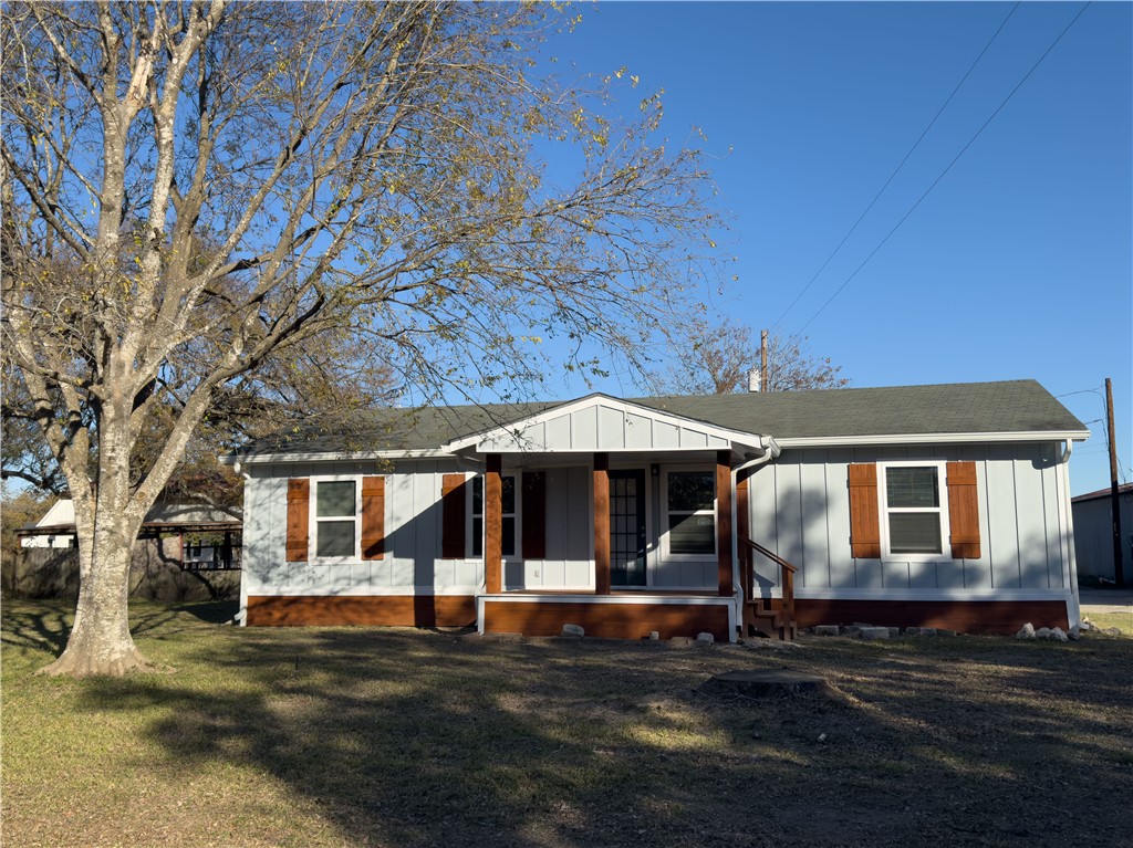 View of front of home featuring covered porch and