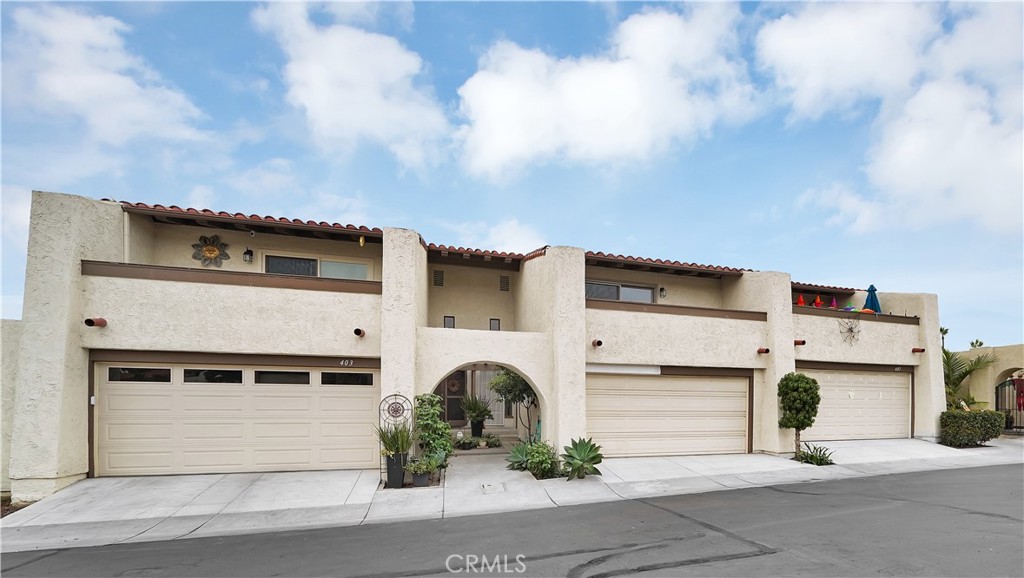 a front view of a house with garage