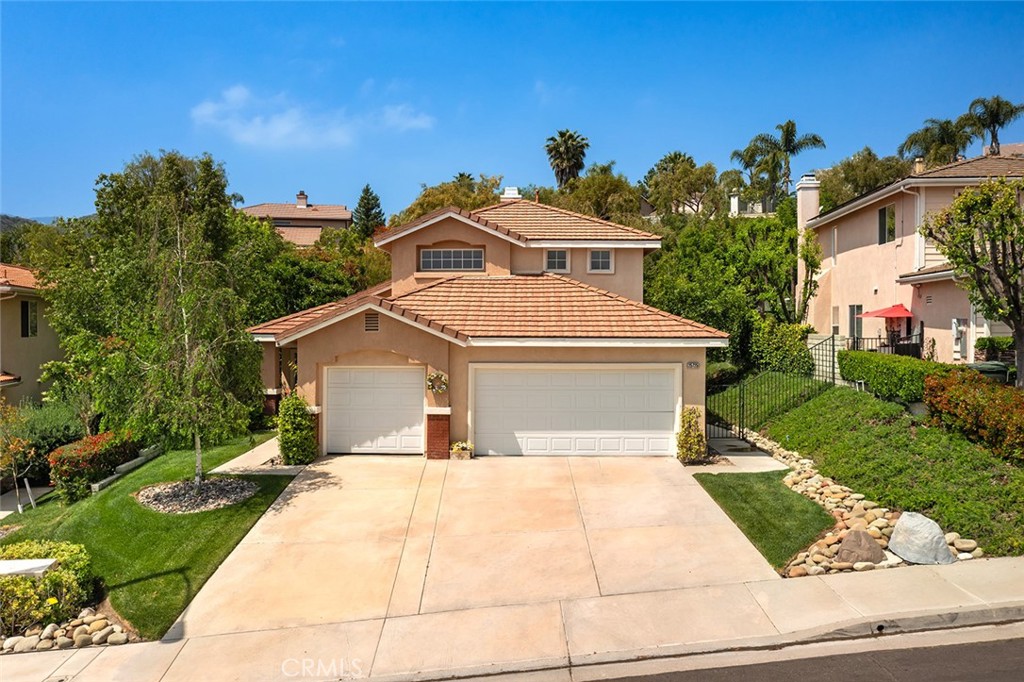 a front view of a house with yard