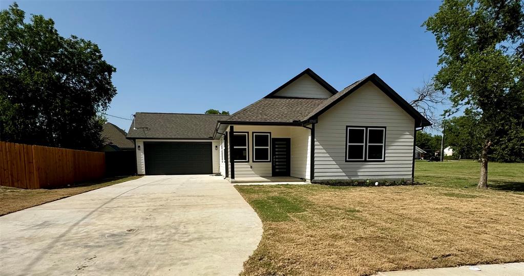 a house with yard in front of it