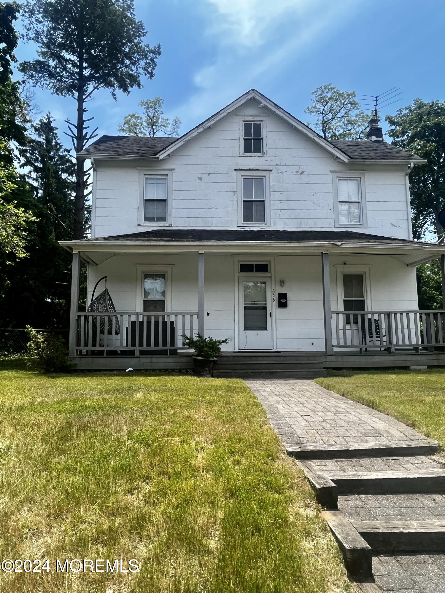 a front view of a house with swimming pool