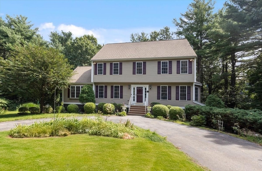 a aerial view of a house with a yard