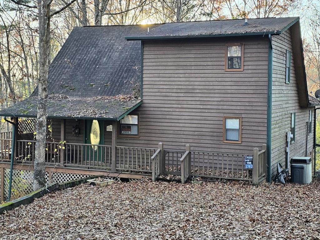 a front view of a house with parking space