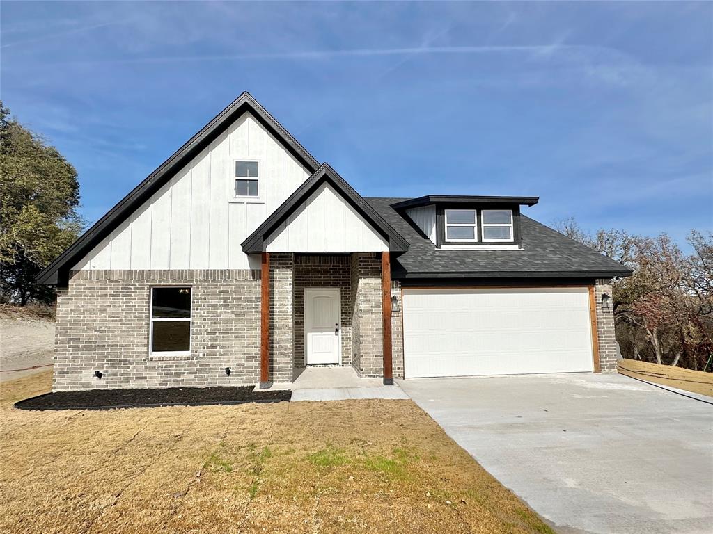 a front view of a house with yard