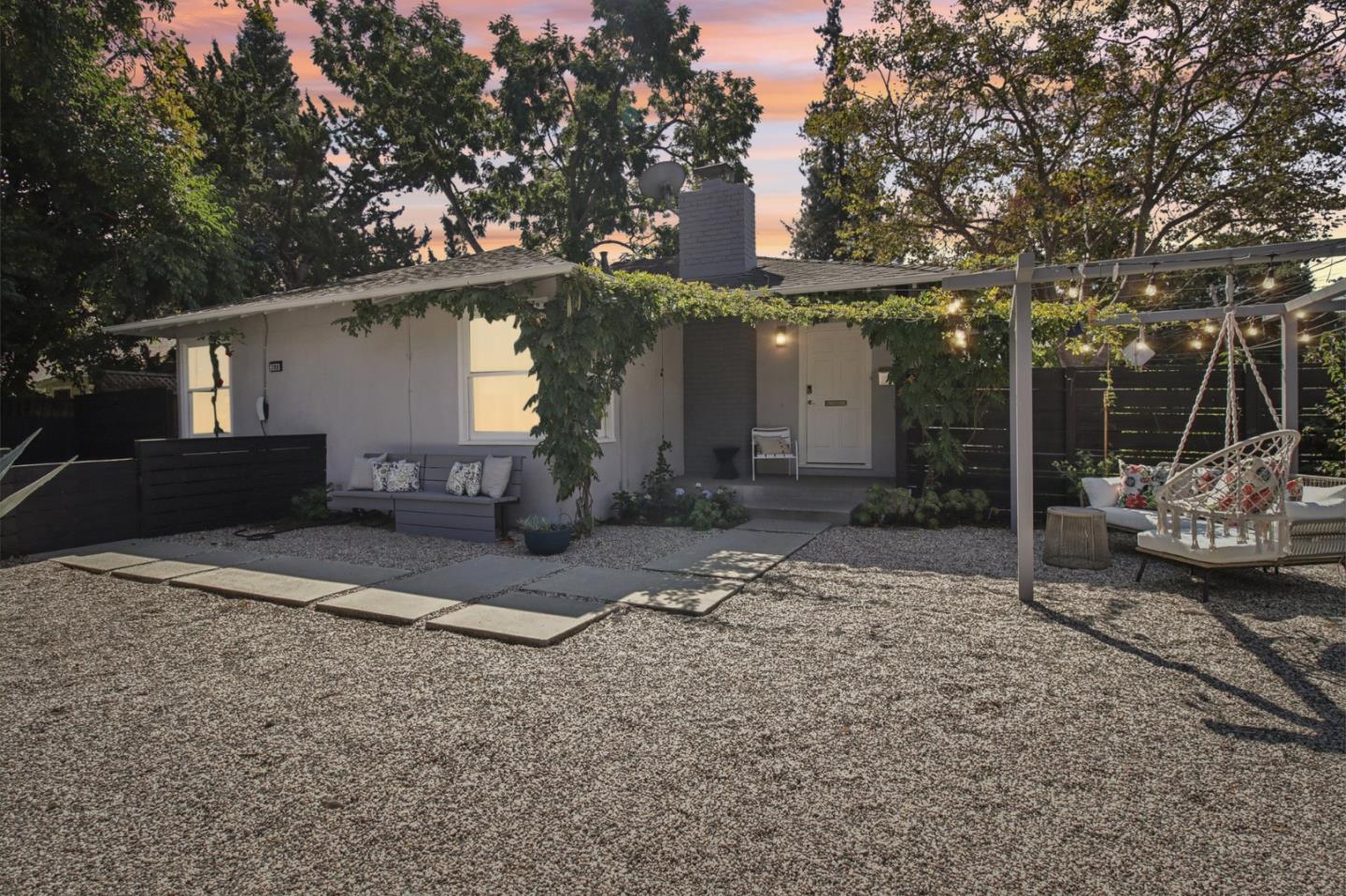 a front view of a house with garden