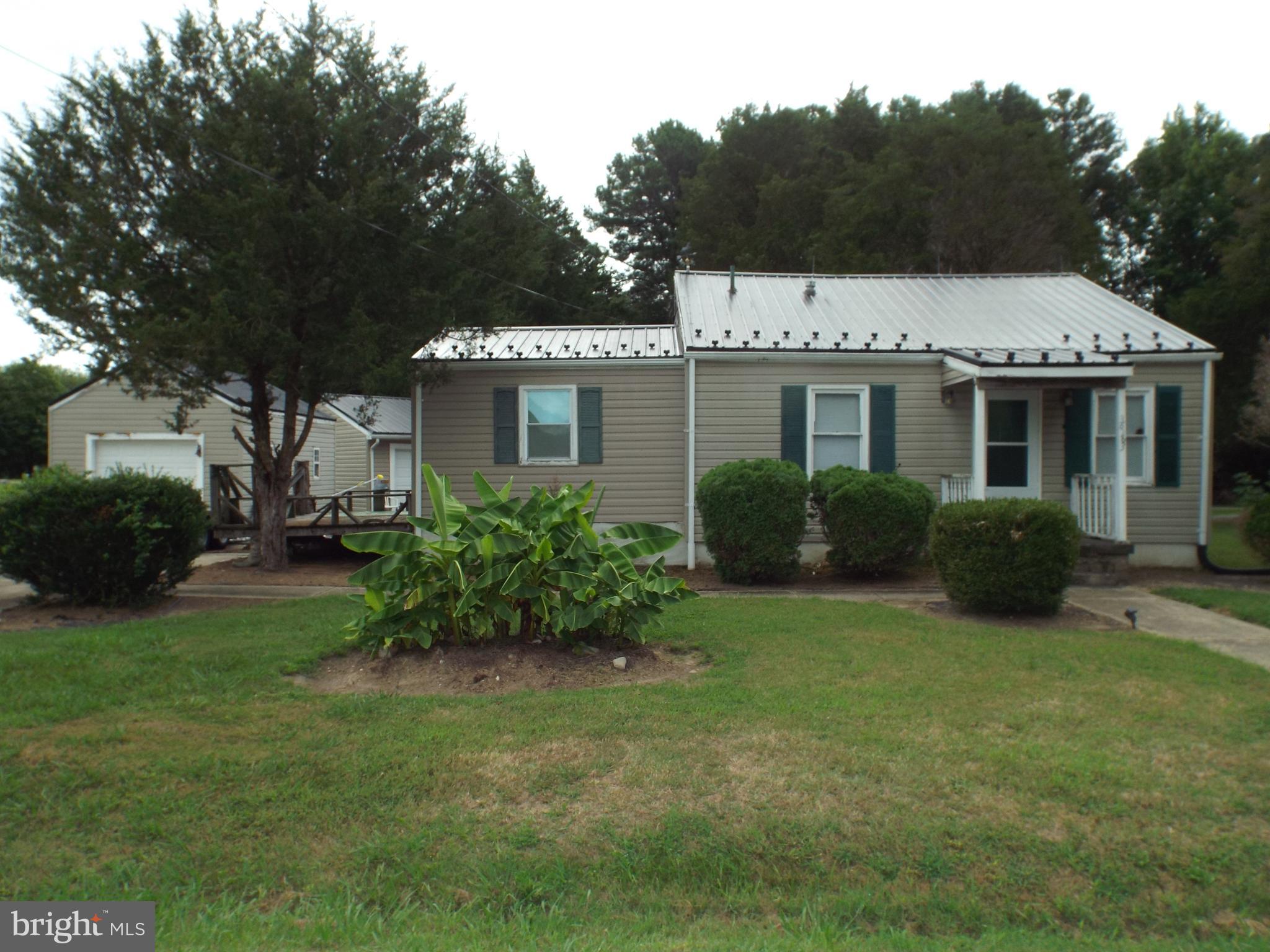 a house view with a garden space