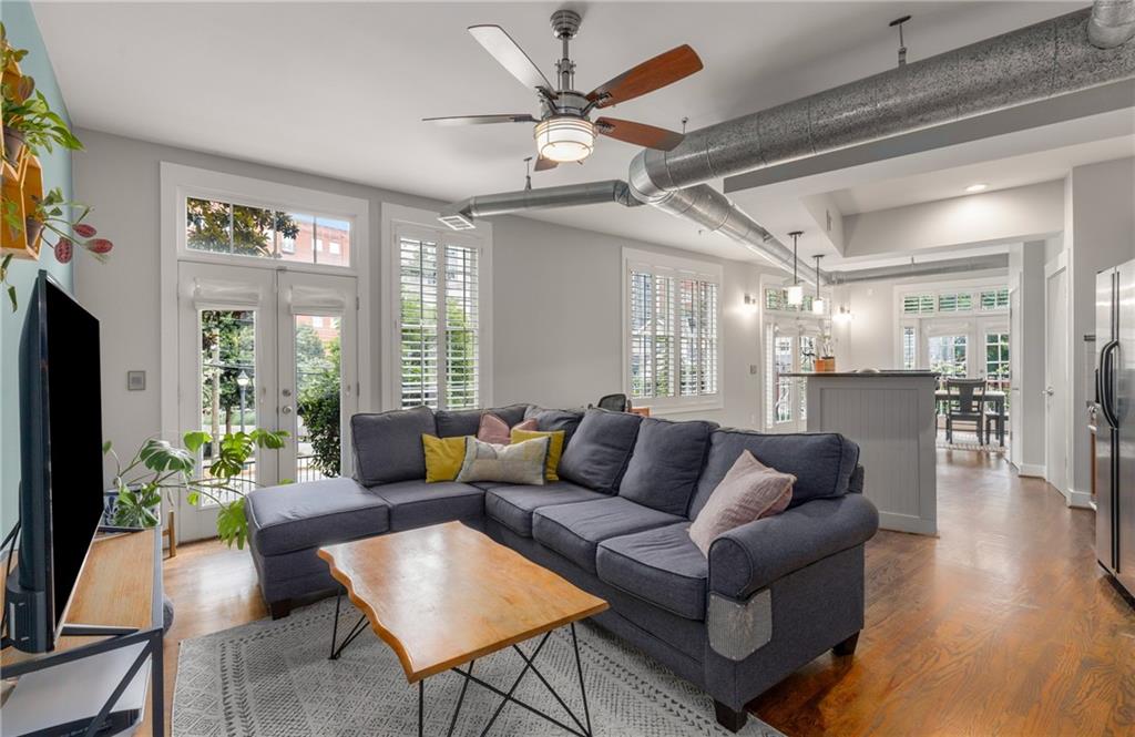 a living room with furniture and a large window