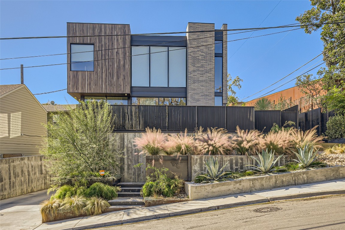 a view of a house with a fence