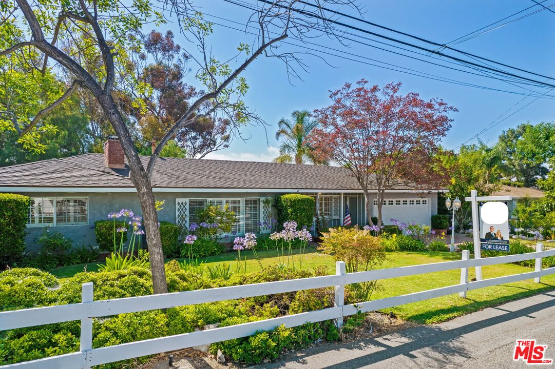 front view of a house with a big yard