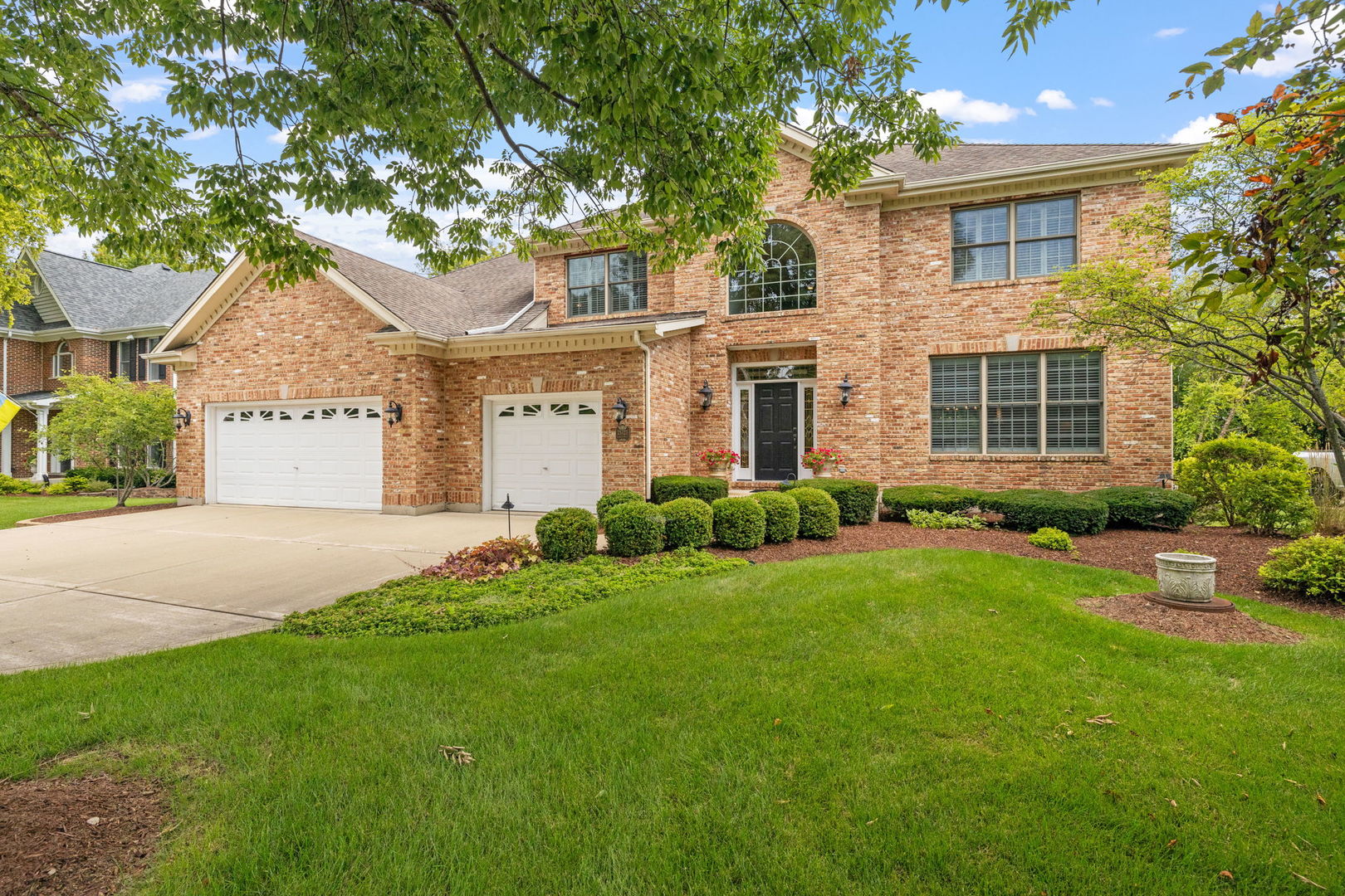 front view of a house and a yard