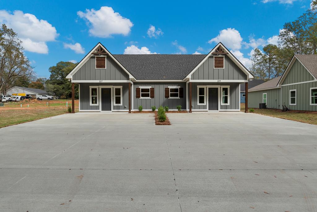 front view of a house with a yard