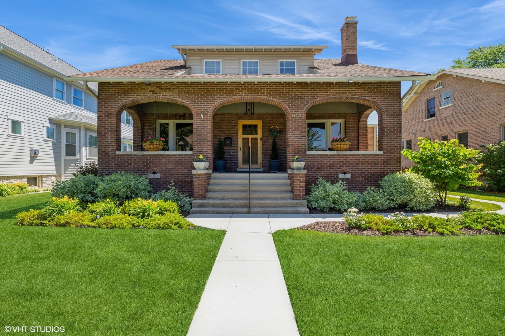 a front view of a house with a garden