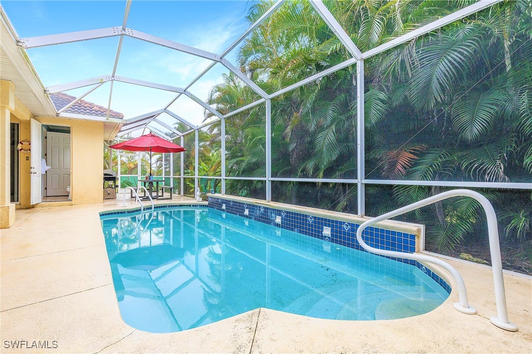 a view of a swimming pool with a patio