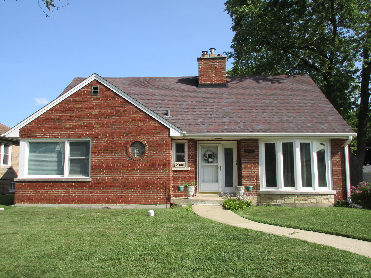 a house view with a garden space