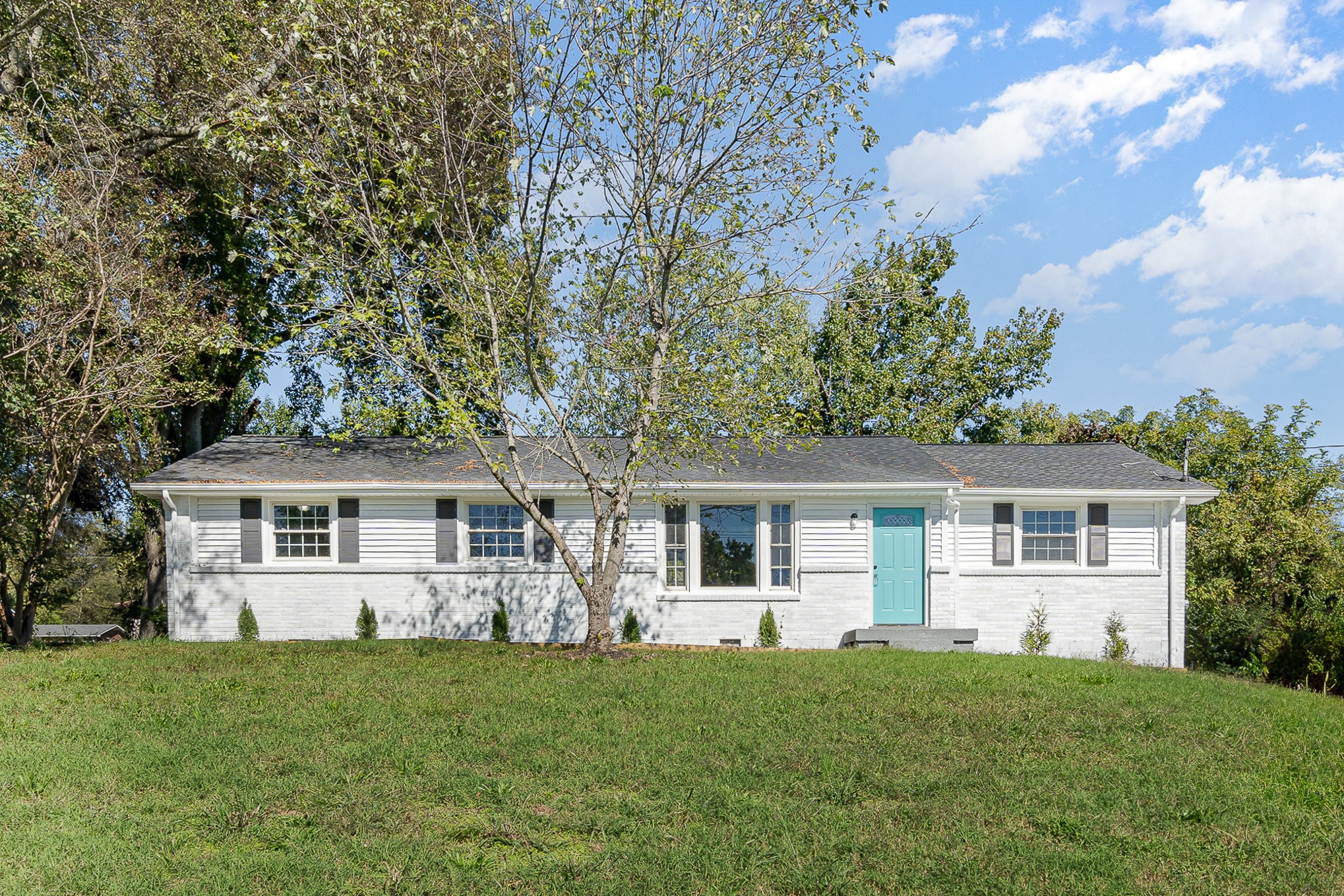 front view of a house with a yard