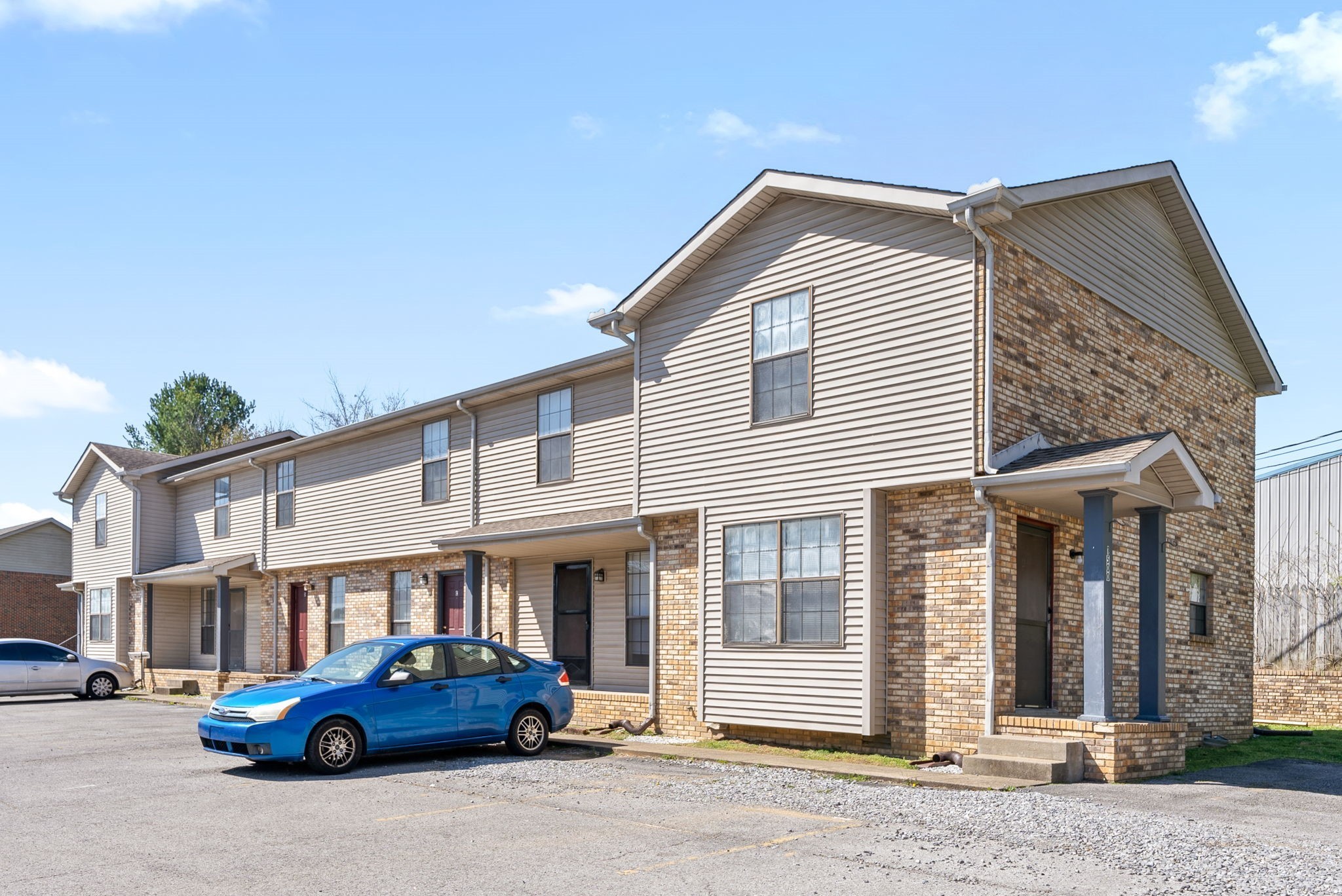 a front view of a house with parking