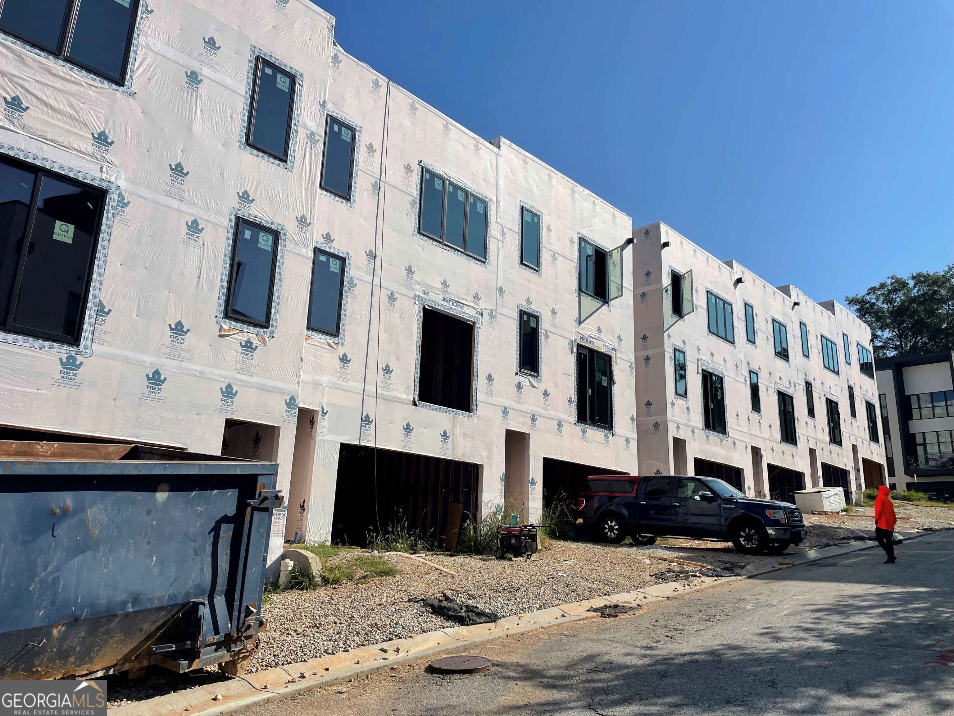 a view of building with parking area