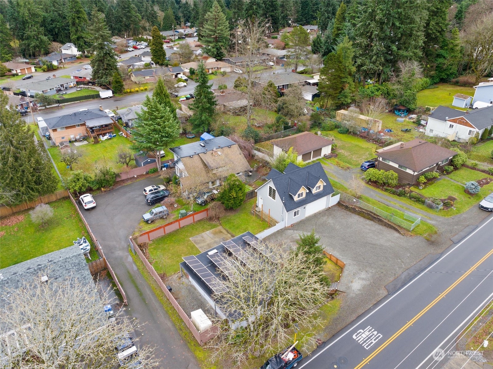 an aerial view of a house with a swimming pool