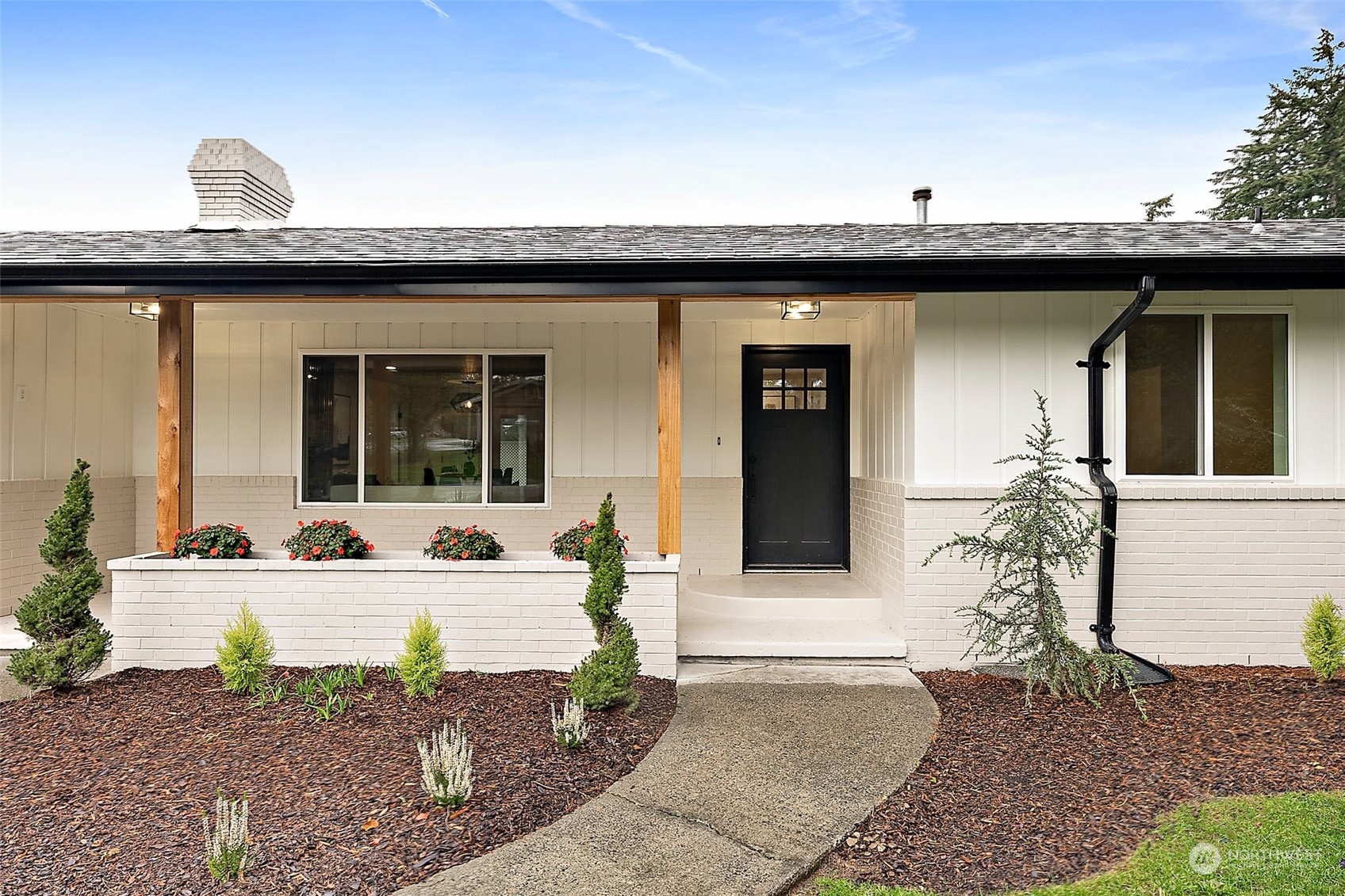 a view of a white house with a outdoor space